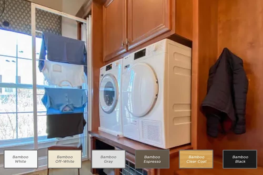 30-inch DryAway pullout laundry drying rack shown in available Bamboo color options, extended next to a washer and dryer