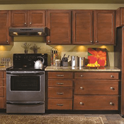 Amerock's Nature's Splendor Cup Pull with a 3-inch length and Oil-Rubbed Bronze finish, showcasing a leaf design.
