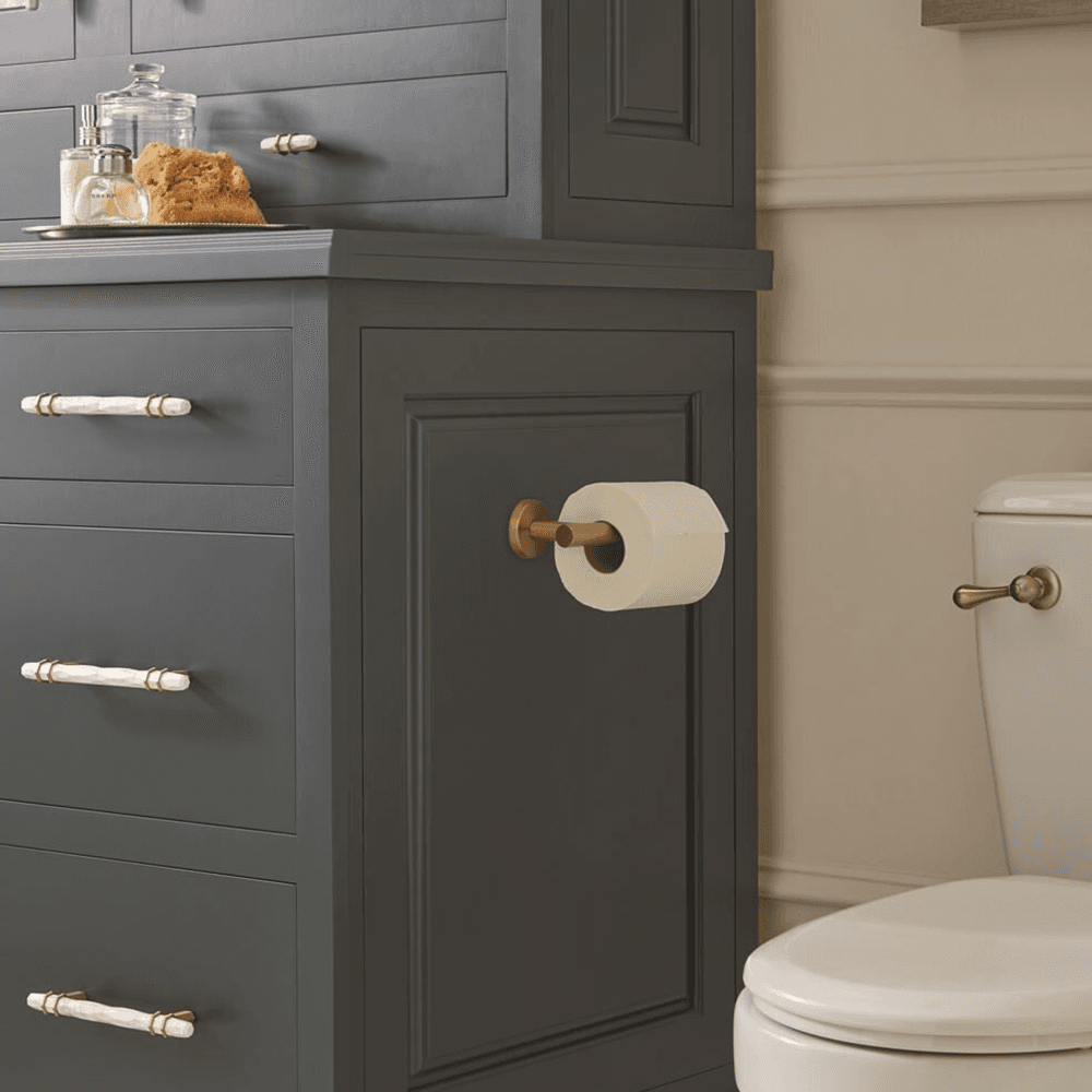 Close-up of ARRONDI Single Post Tissue Roll Holder in Golden Champagne finish