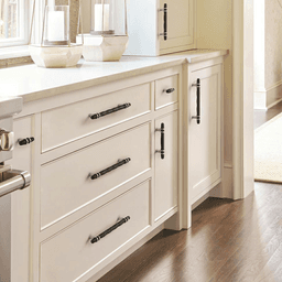 Amerock London Cabinet Pull in Golden Champagne/Black Chrome - Installed on a kitchen cabinet