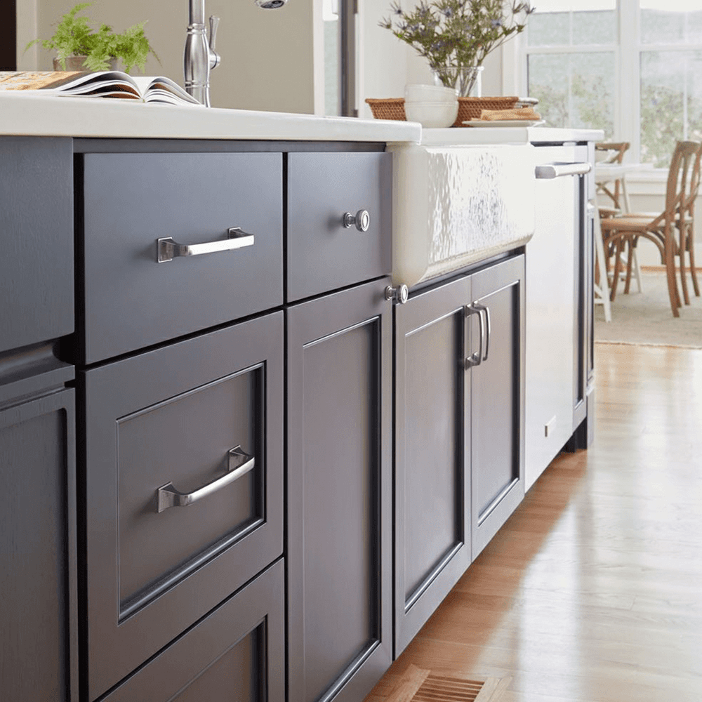 Amerock Ville Collection 1-1/8" Matte Black Cabinet Knob on Blue Cabinet Door
