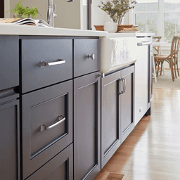 Amerock Ville Collection 1-1/8" Matte Black Cabinet Knob on Blue Cabinet Door