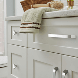 Amerock Premise Cabinet Pull in Satin Nickel on Blue Background
