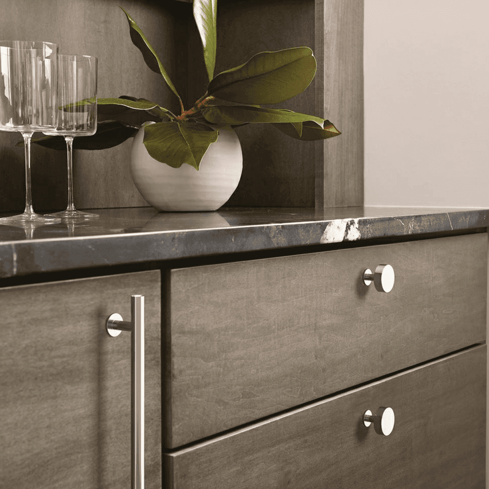 Amerock Radius Satin Nickel Knob on Blue Cabinet Door with White Hardware