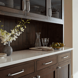 Amerock Surpass Knob in Satin Nickel Finish featuring bowing, rounded forms and square pedestal feet