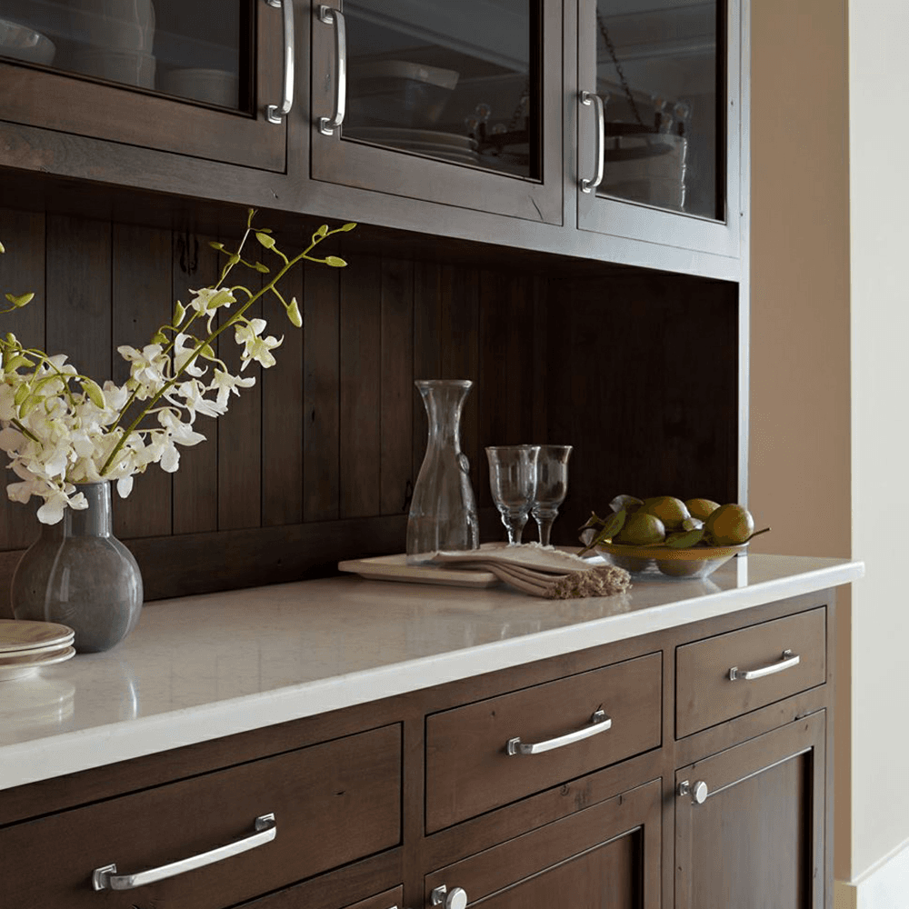Champagne bronze Surpass handle pull on white cabinet