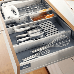 Stainless steel knife holder set with 4 handle supports and locating tab by Blum Orga-Line.
