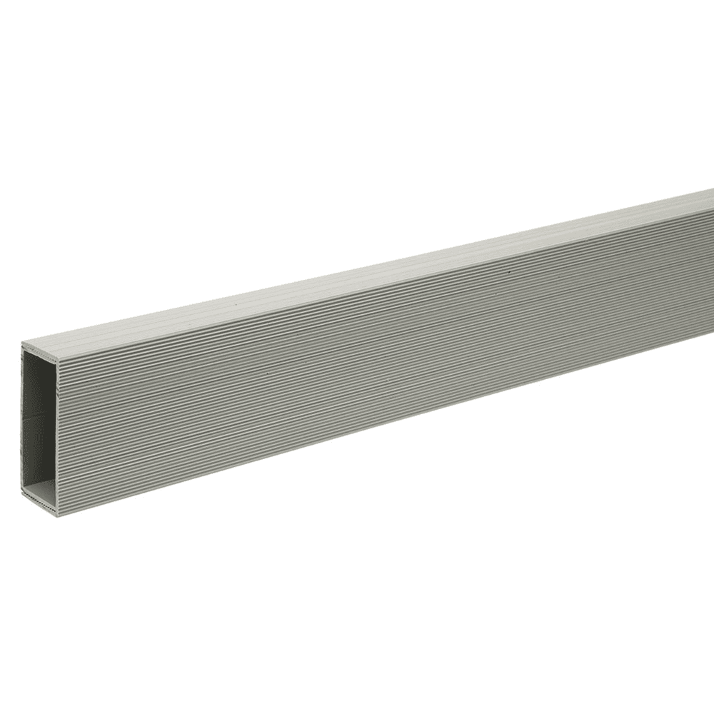 Gray baseboard wire manager installed horizontally along a wall