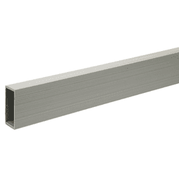 Gray baseboard wire manager installed horizontally along a wall