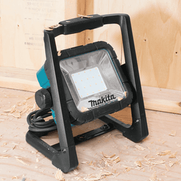 Makita compact LED work light with integrated handle and optional mounting stand