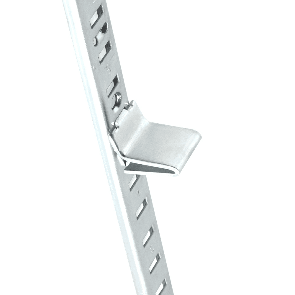 Discreet pilaster clip for holding shelves in bookcases, closets, and cabinets