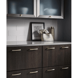 Sleek metal Nouveau Griggs Pull in Honey Bronze for kitchen and bath cabinetry