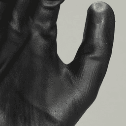 Hand holding gray and black gloves with foam nitrile coating