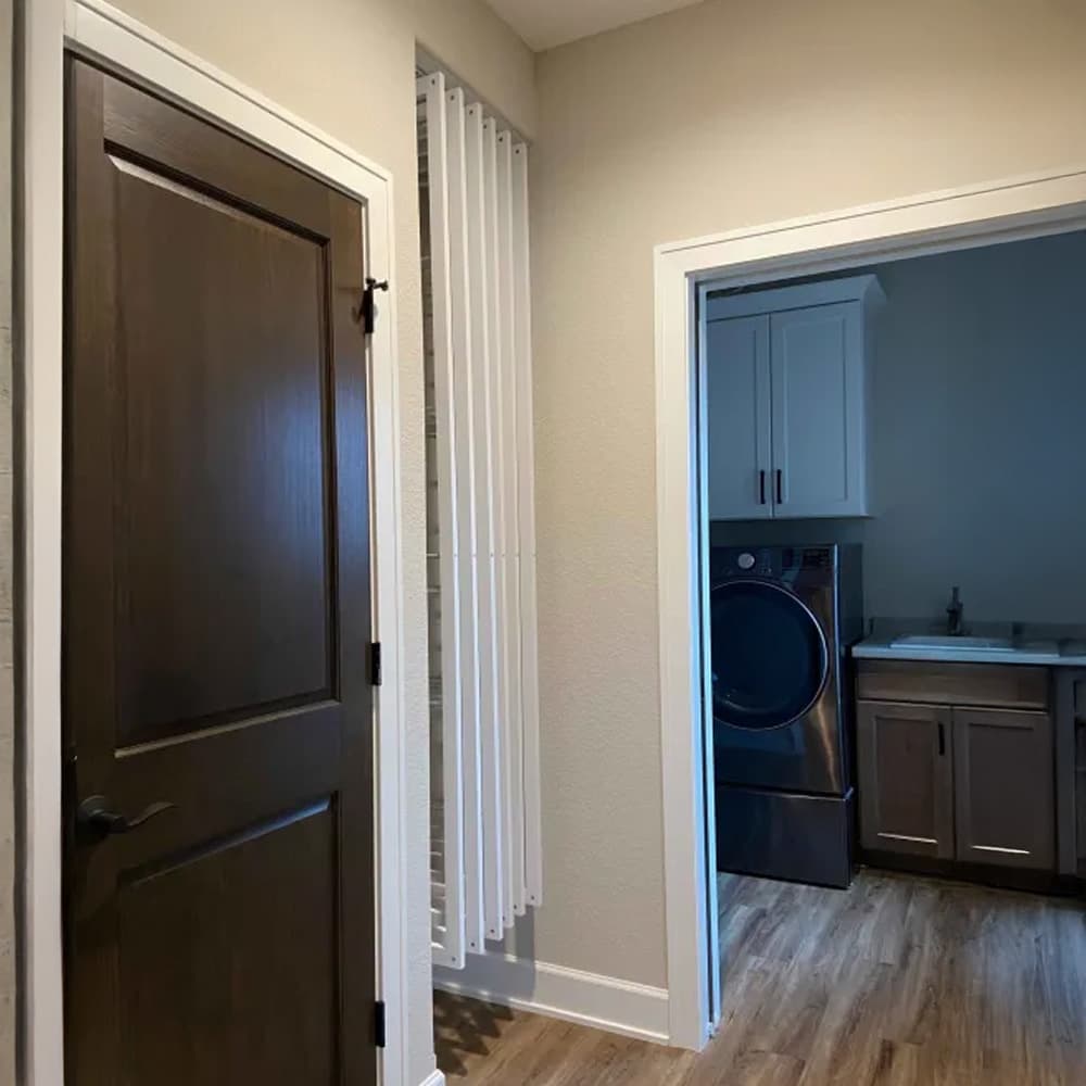 DryAway pullout cabinet drying system showcasing adjustable drying rods and sustainable laundry solution for small spaces