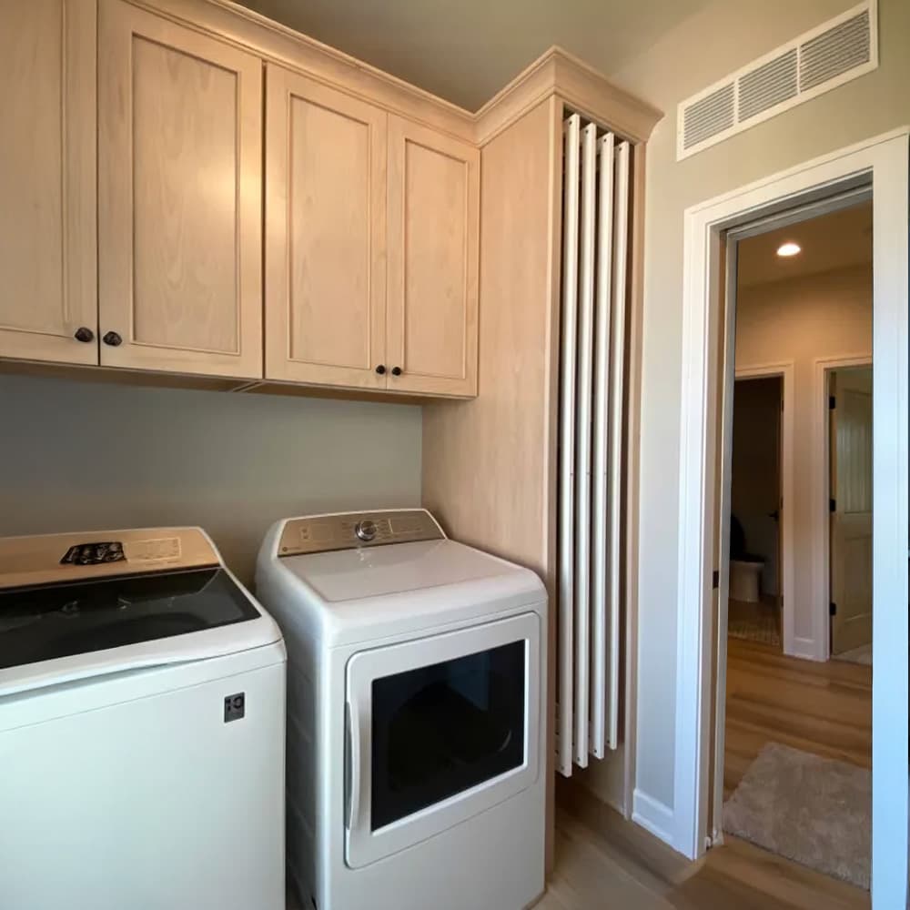 DryAway vertical drying rack installed in custom laundry room cabinetry - retractable laundry system for organized space