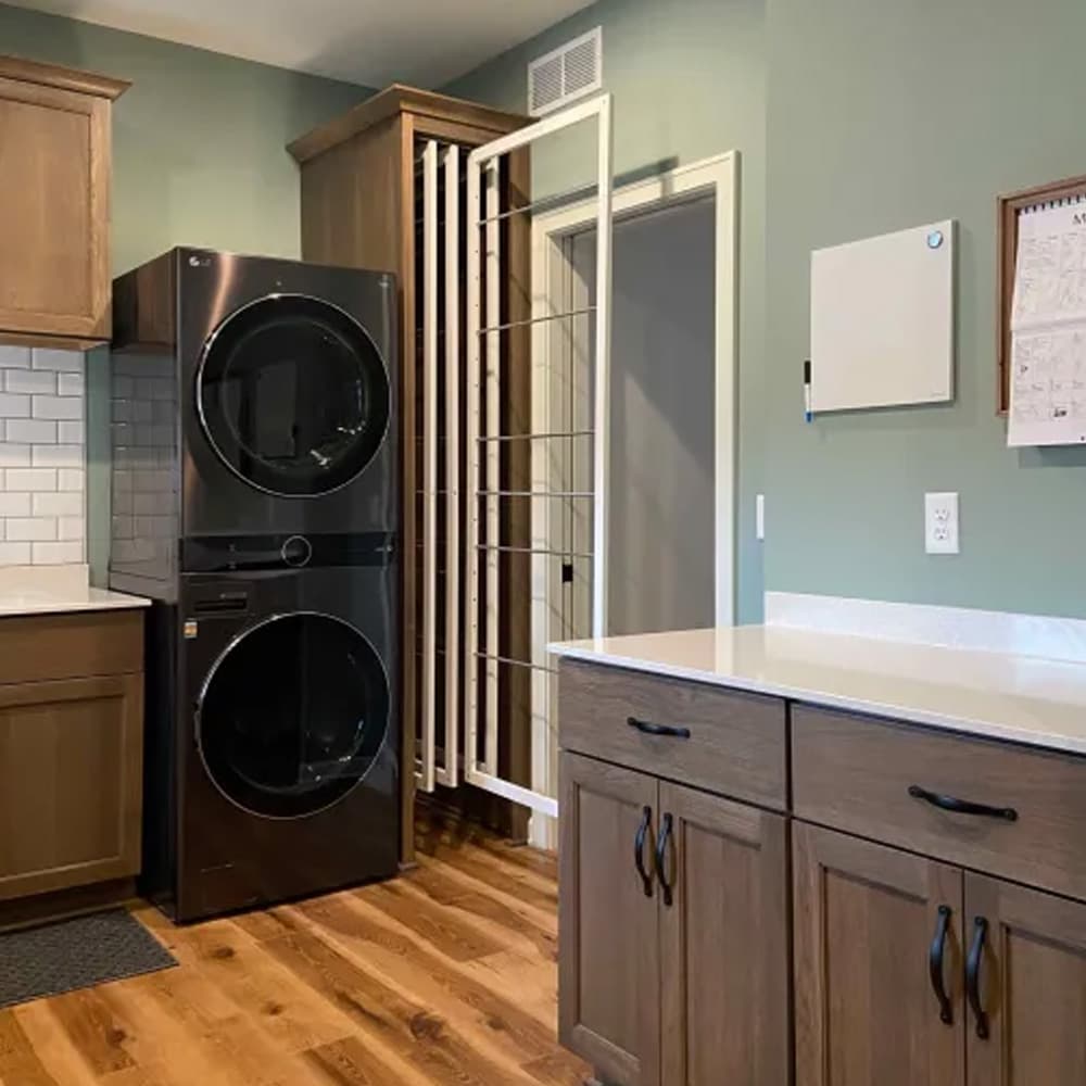 DryAway retractable laundry system concealed when not in use - vertical drying rack maximizing space in a modern home