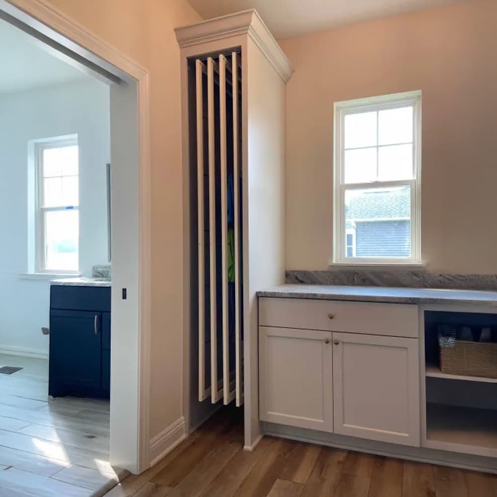DryAway pullout cabinet drying system showcasing adjustable drying rods and sustainable laundry solution for small spaces