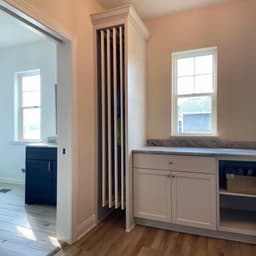 DryAway pullout cabinet drying system showcasing adjustable drying rods and sustainable laundry solution for small spaces